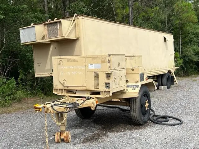 Tan generator trailer with cables connected