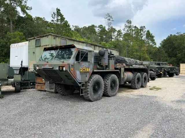 Eight-wheel Force 1 Logistics truck in a line of vehicles