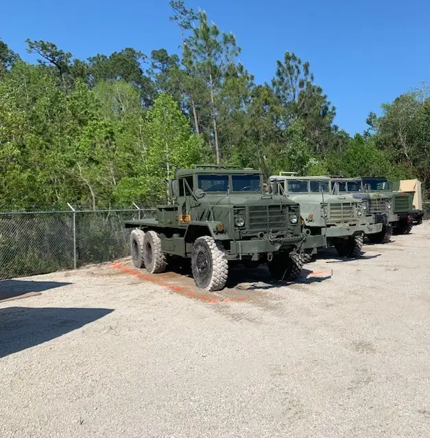 Trucks parked in a row at the staging yard