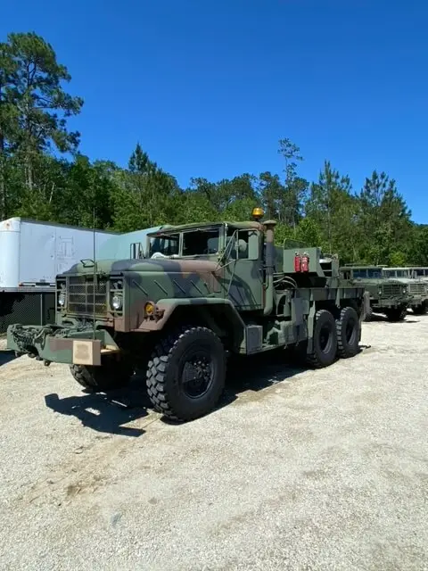 Camouflage six-wheel truck at the yard