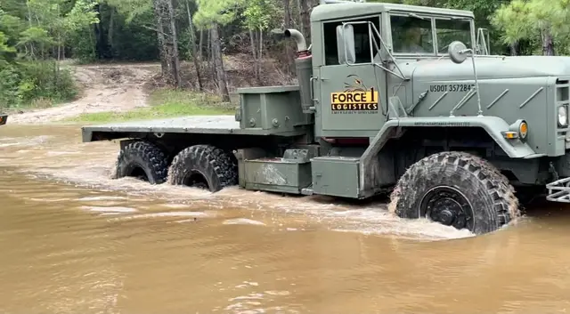 Force 1 Logistics truck pushing through deep flood water