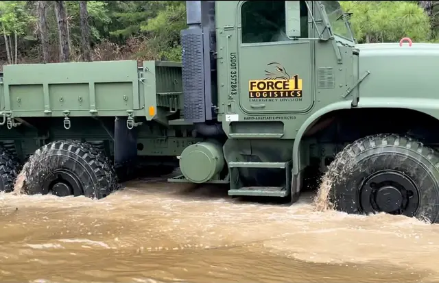 Force 1 Logistics truck in flood water up to its wheels