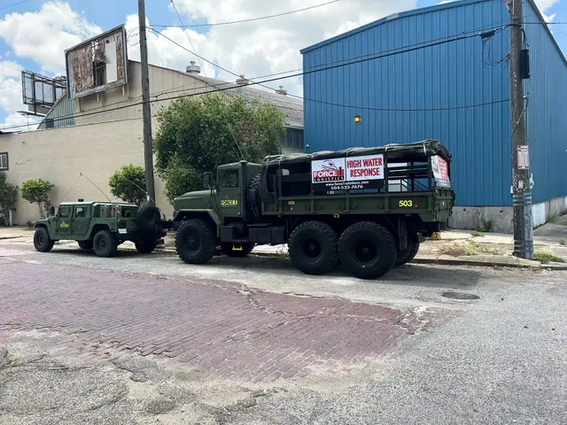 Force 1 high water response truck and utility vehicle parked on a New Orleans street