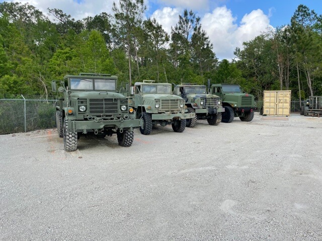 Six-wheel trucks parked at the staging yard